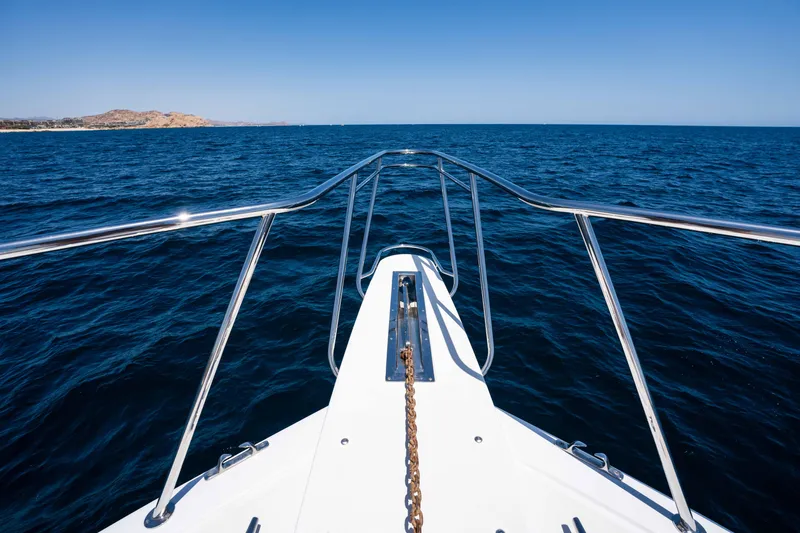 Santana Yacht Photos Pics Bow view of 2003 Viking 65 Convertible yacht cruising on open sea.