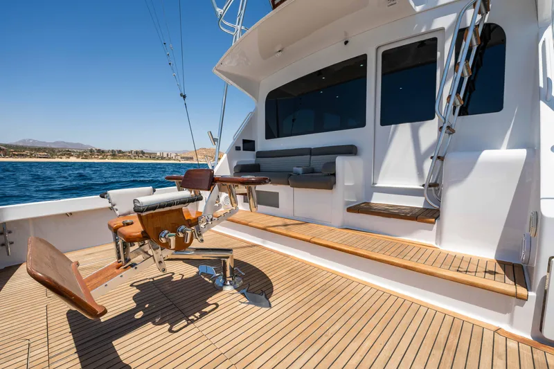 Santana Yacht Photos Pics 2003 Viking 65 Convertible yacht deck with fishing chair and ocean view.