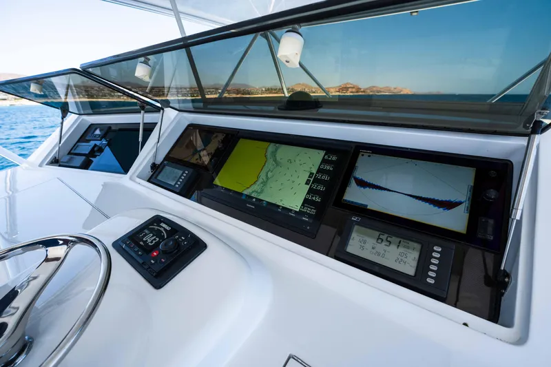 Santana Yacht Photos Pics 2003 Viking 65 Convertible yacht dashboard with navigation screens and controls.