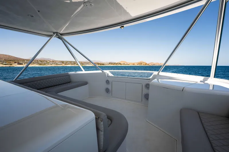 Santana Yacht Photos Pics 2003 Viking 65 Convertible yacht interior with ocean view and seating area.