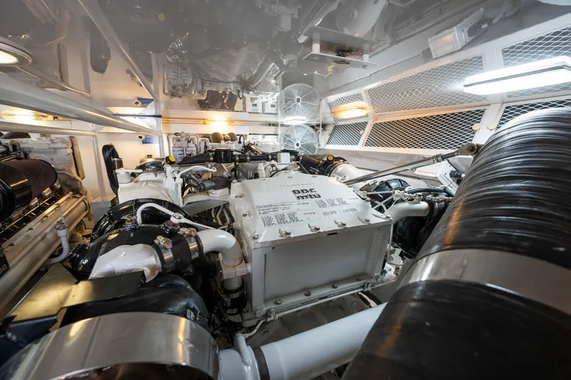 Santana Yacht Photos Pics Engine room of 2003 Viking 65 Convertible yacht, showcasing powerful machinery and clean design.