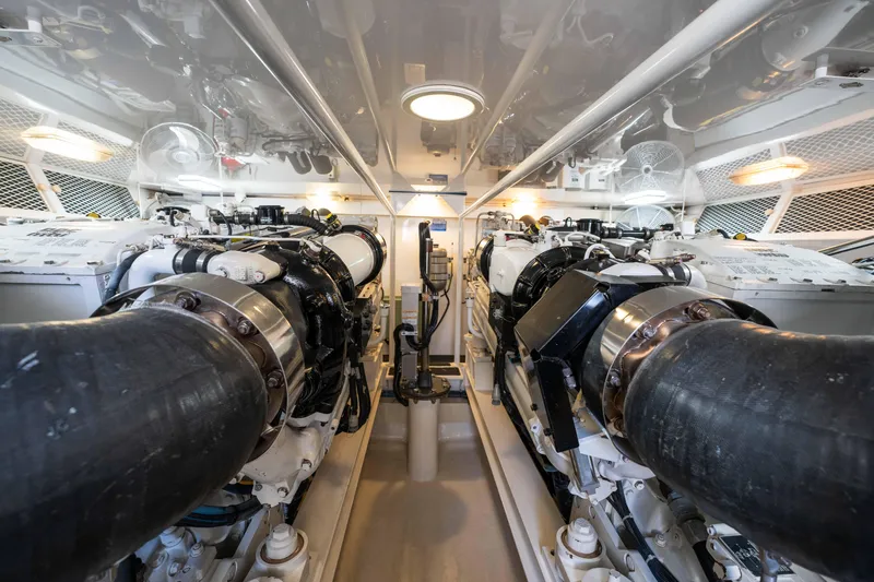Santana Yacht Photos Pics Engine room of 2003 Viking 65 Convertible yacht, showcasing dual engines and mechanical components.