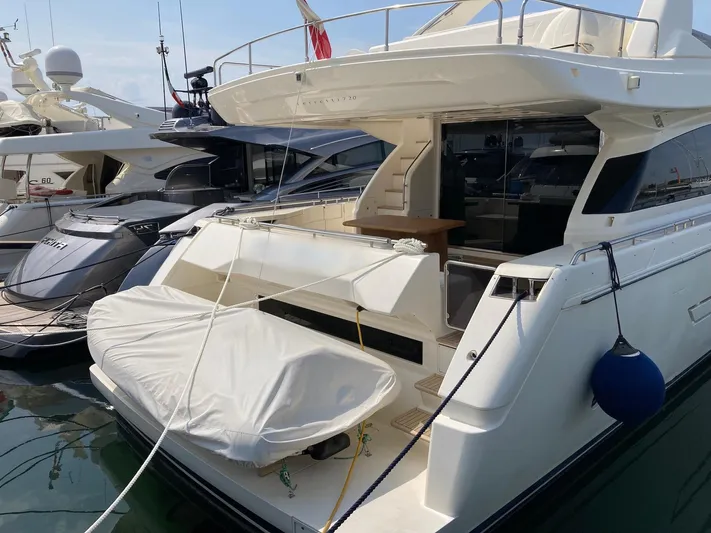 4771 Yacht Photos Pics Luxury Ferretti 720 yacht, 2013 model, docked with covered tender.