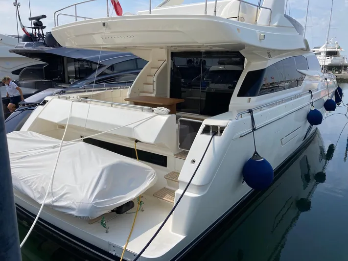 4771 Yacht Photos Pics 2013 Ferretti Yachts 720 docked, featuring sleek design and spacious deck area.