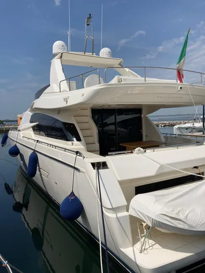 4771 Yacht Photos Pics Luxury 2013 Ferretti 720 yacht docked, featuring sleek design and Italian flag.