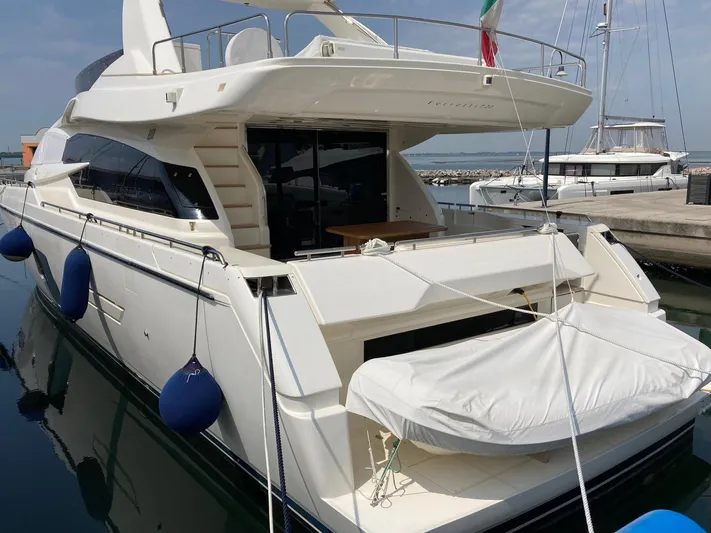 4771 Yacht Photos Pics Luxurious 2013 Ferretti 720 yacht docked, showcasing sleek design and spacious deck.