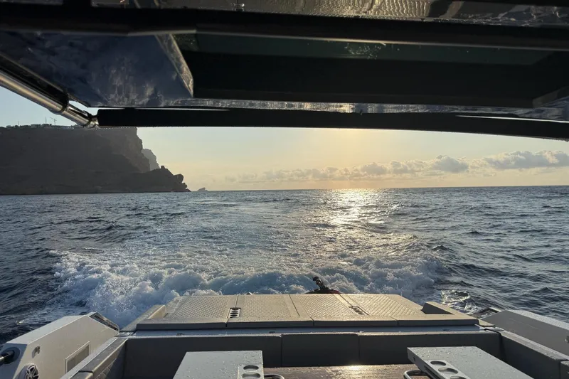  Yacht Photos Pics 2025 De Antonio Yachts D50 cruising at sunset, ocean view from the deck.