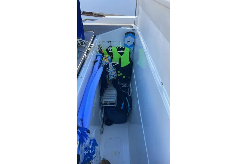  Yacht Photos Pics Storage compartment on 2025 De Antonio Yachts D50 with life jackets and pool noodles.