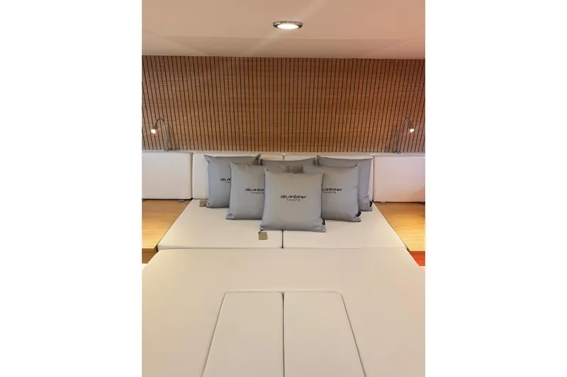  Yacht Photos Pics Luxurious interior of 2025 De Antonio Yachts D50 with elegant cushions and modern lighting.