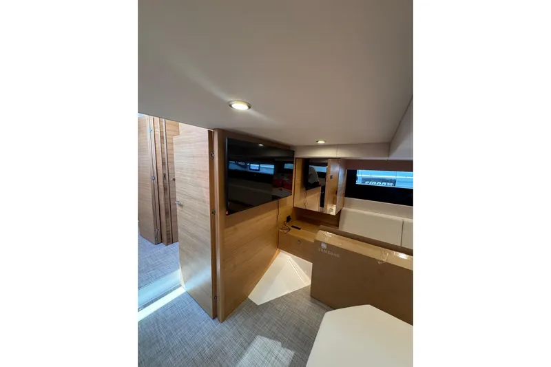  Yacht Photos Pics Interior of 2025 De Antonio Yachts D50, featuring modern wood paneling and sleek design.