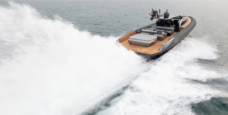  Yacht Photos Pics 2025 Anvera 58 speedboat cruising swiftly on open water.