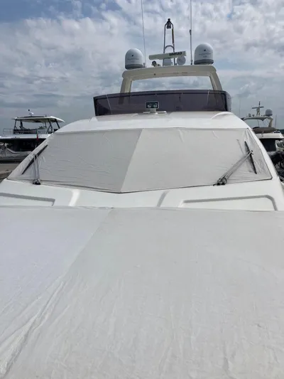 4771 Yacht Photos Pics 2013 Ferretti Yachts 720 with covered deck, docked under a cloudy sky.