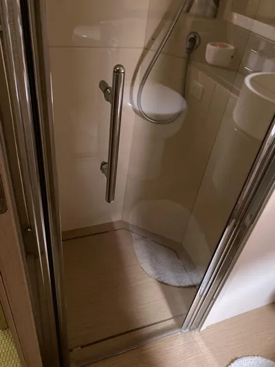 4771 Yacht Photos Pics Shower area in 2013 Ferretti Yachts 720, featuring glass door and modern fixtures.