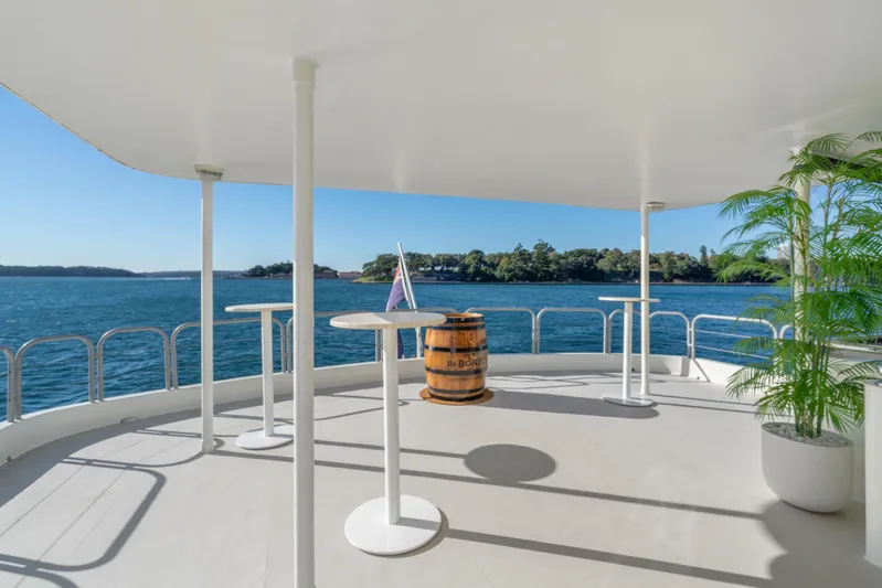 Coast Yacht Photos Pics Spacious deck of 2006 Suncoast 65 yacht with ocean view and potted plant.