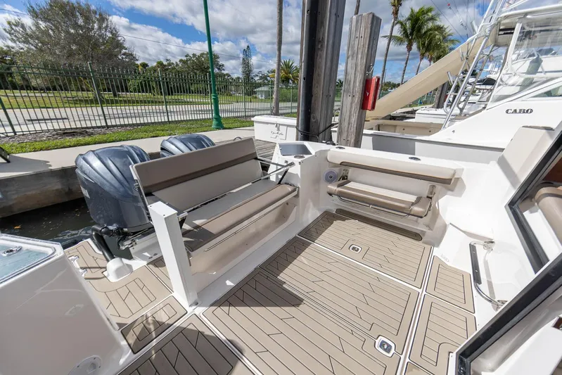  Yacht Photos Pics 2023 Cutwater C-288 boat deck with seating, dual engines, and modern design.