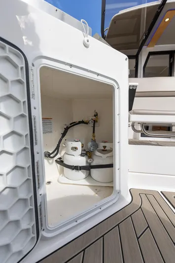  Yacht Photos Pics 2023 Cutwater C-288 boat storage compartment with propane tanks.
