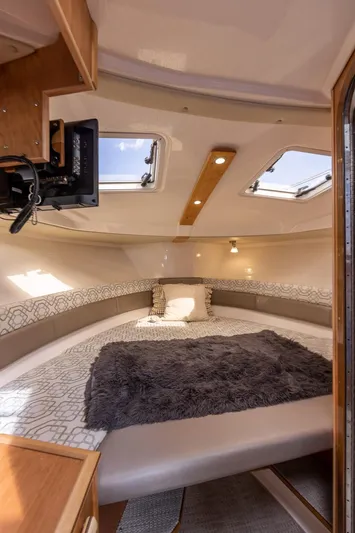  Yacht Photos Pics 2023 Cutwater C-288 cabin interior with cozy bed, skylights, and modern design.