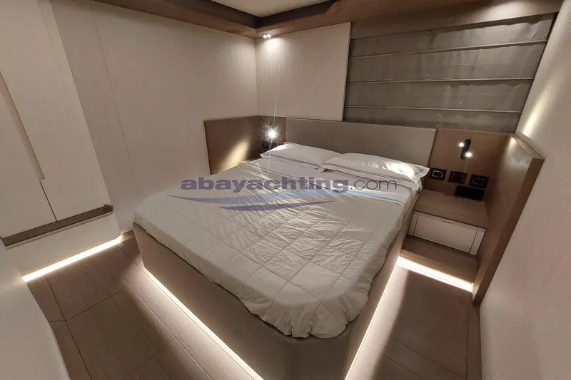  Yacht Photos Pics Luxurious bedroom interior of 2024 Pardo Endurance 72 yacht with modern design and ambient lighting.