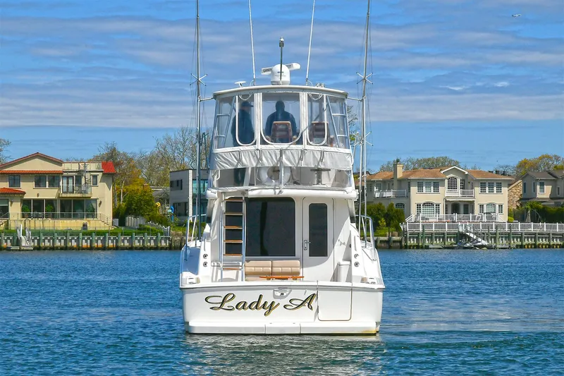Lady A Yacht Photos Pics 2017 Tiara Yachts 39 Convertible on water, rear view, with "Lady A" name visible.
