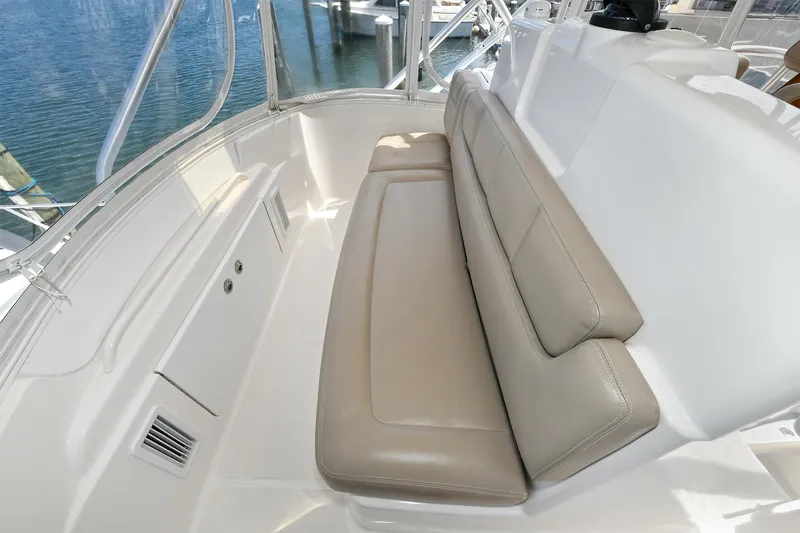 Lady A Yacht Photos Pics 2017 Tiara Yachts 39 Convertible seating area with beige cushions and marina view.