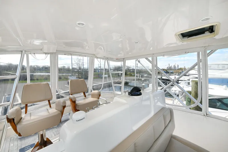 Lady A Yacht Photos Pics Interior view of 2017 Tiara Yachts 39 Convertible, featuring helm and seating area.