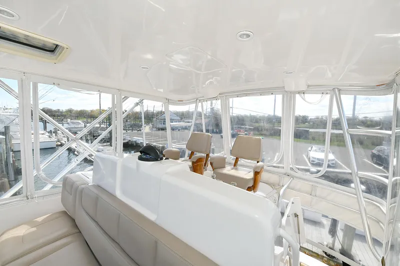 Lady A Yacht Photos Pics Interior view of 2017 Tiara Yachts 39 Convertible, featuring helm and seating area.