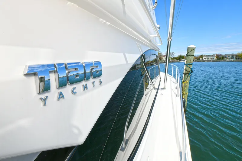 Lady A Yacht Photos Pics 2017 Tiara Yachts 39 Convertible docked by serene waters.