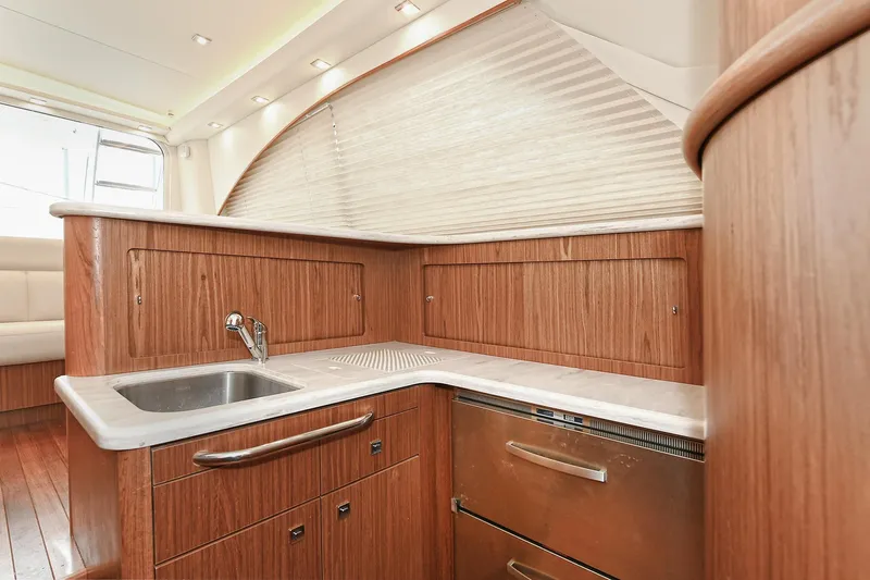 Lady A Yacht Photos Pics 2017 Tiara Yachts 39 Convertible kitchen with wood cabinetry and stainless steel sink.