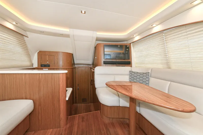 Lady A Yacht Photos Pics Luxurious interior of 2017 Tiara Yachts 39 Convertible with elegant wood finishes and seating.