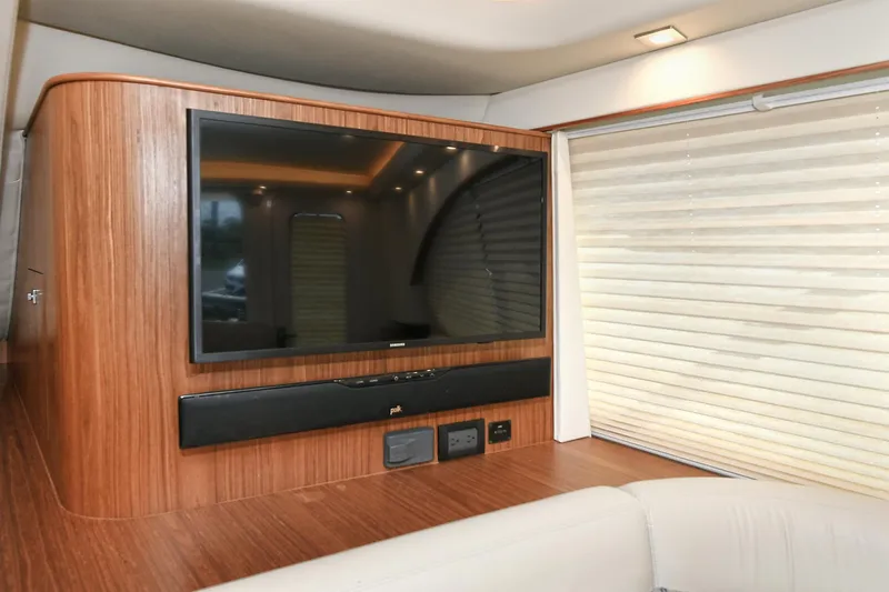 Lady A Yacht Photos Pics Interior of 2017 Tiara Yachts 39 Convertible with TV and wood paneling.