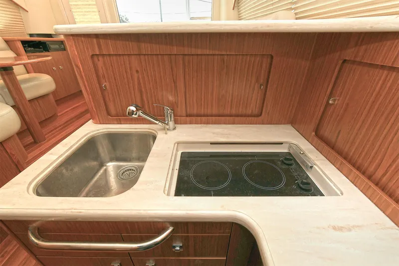 Lady A Yacht Photos Pics Modern kitchen in 2017 Tiara Yachts 39 Convertible with sink and stovetop.