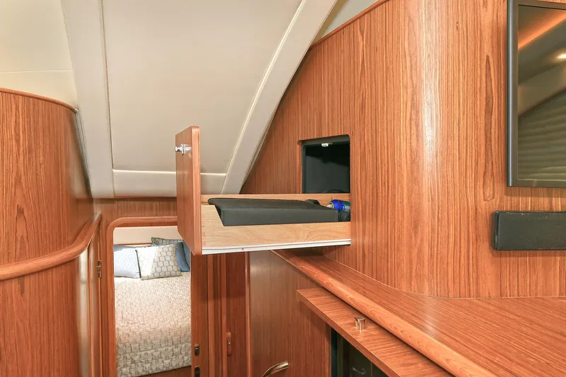 Lady A Yacht Photos Pics Interior of 2017 Tiara Yachts 39 Convertible with open wooden cabinet.