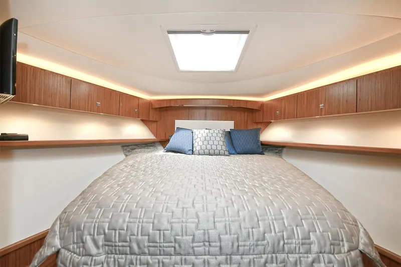 Lady A Yacht Photos Pics Luxurious bedroom interior of 2017 Tiara Yachts 39 Convertible with elegant bedding.