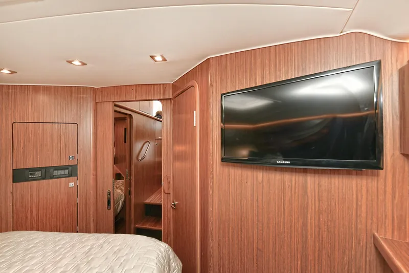 Lady A Yacht Photos Pics Interior of 2017 Tiara Yachts 39 Convertible with wood paneling and wall-mounted TV.