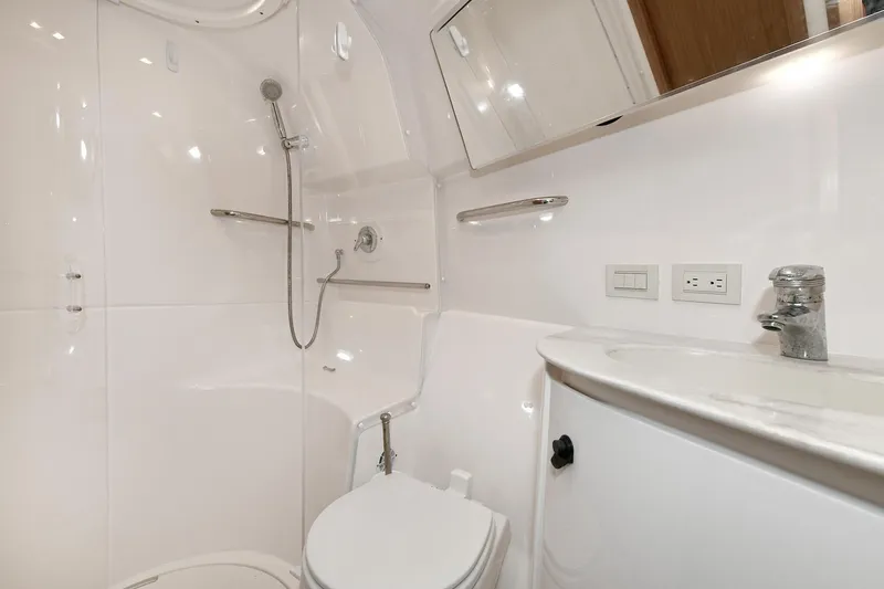 Lady A Yacht Photos Pics 2017 Tiara Yachts 39 Convertible bathroom with modern fixtures and sleek design.