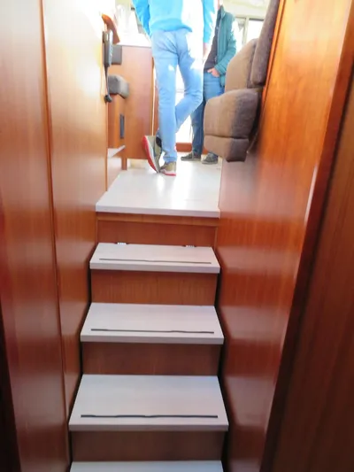  Yacht Photos Pics Interior stairs of 2018 Moody 54 DS yacht with wooden finish.