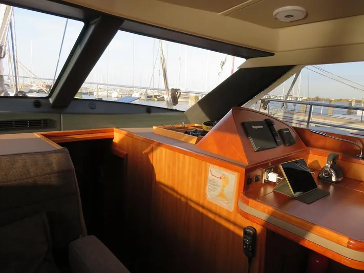  Yacht Photos Pics Interior view of 2018 Moody 54 DS yacht cockpit with navigation equipment.