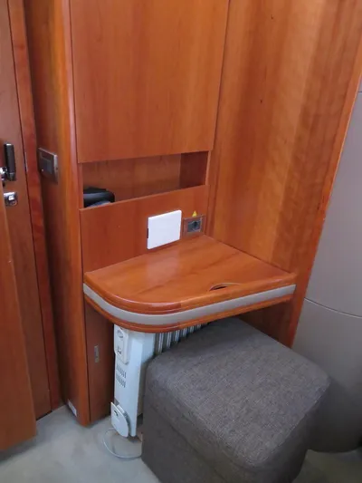  Yacht Photos Pics Wooden desk area with stool in 2018 Moody 54 DS yacht interior.