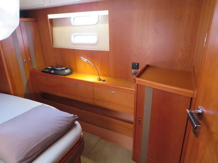  Yacht Photos Pics Luxurious wooden interior of 2018 Moody 54 DS yacht cabin with modern furnishings.