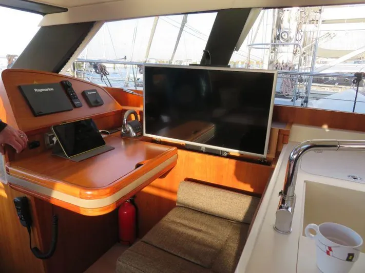  Yacht Photos Pics Interior of 2018 Moody 54 DS yacht with navigation station and modern amenities.