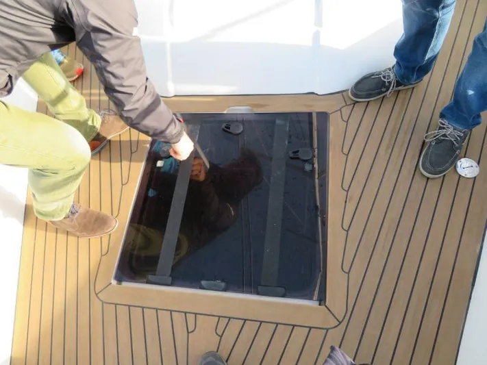  Yacht Photos Pics People inspecting hatch on 2018 Moody 54 DS yacht deck.