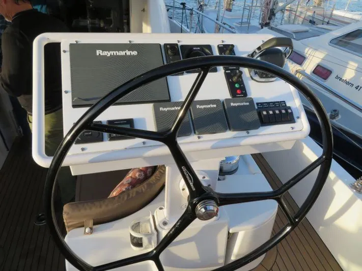  Yacht Photos Pics Steering wheel and control panel of 2018 Moody 54 DS yacht with Raymarine equipment.