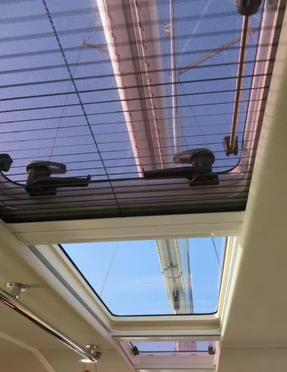  Yacht Photos Pics Skylight view from inside a 2018 Moody 54 DS yacht, showcasing rigging and clear blue sky.