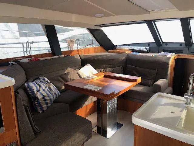  Yacht Photos Pics Luxurious interior of 2018 Moody 54 DS yacht with cozy seating and modern design.
