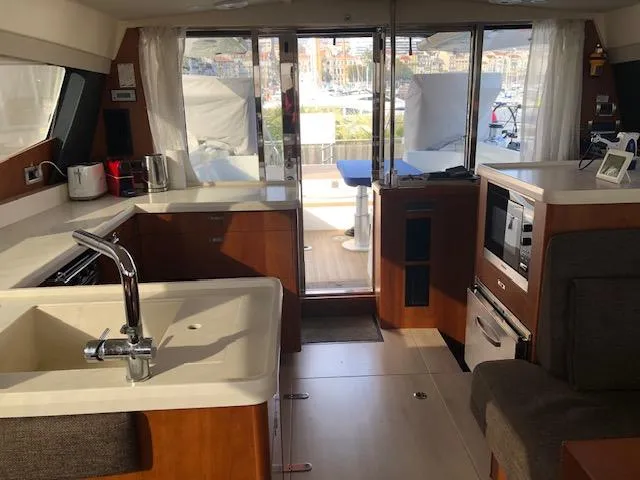  Yacht Photos Pics Luxurious Moody 54 DS yacht interior with modern kitchen and spacious seating, 2018 model.