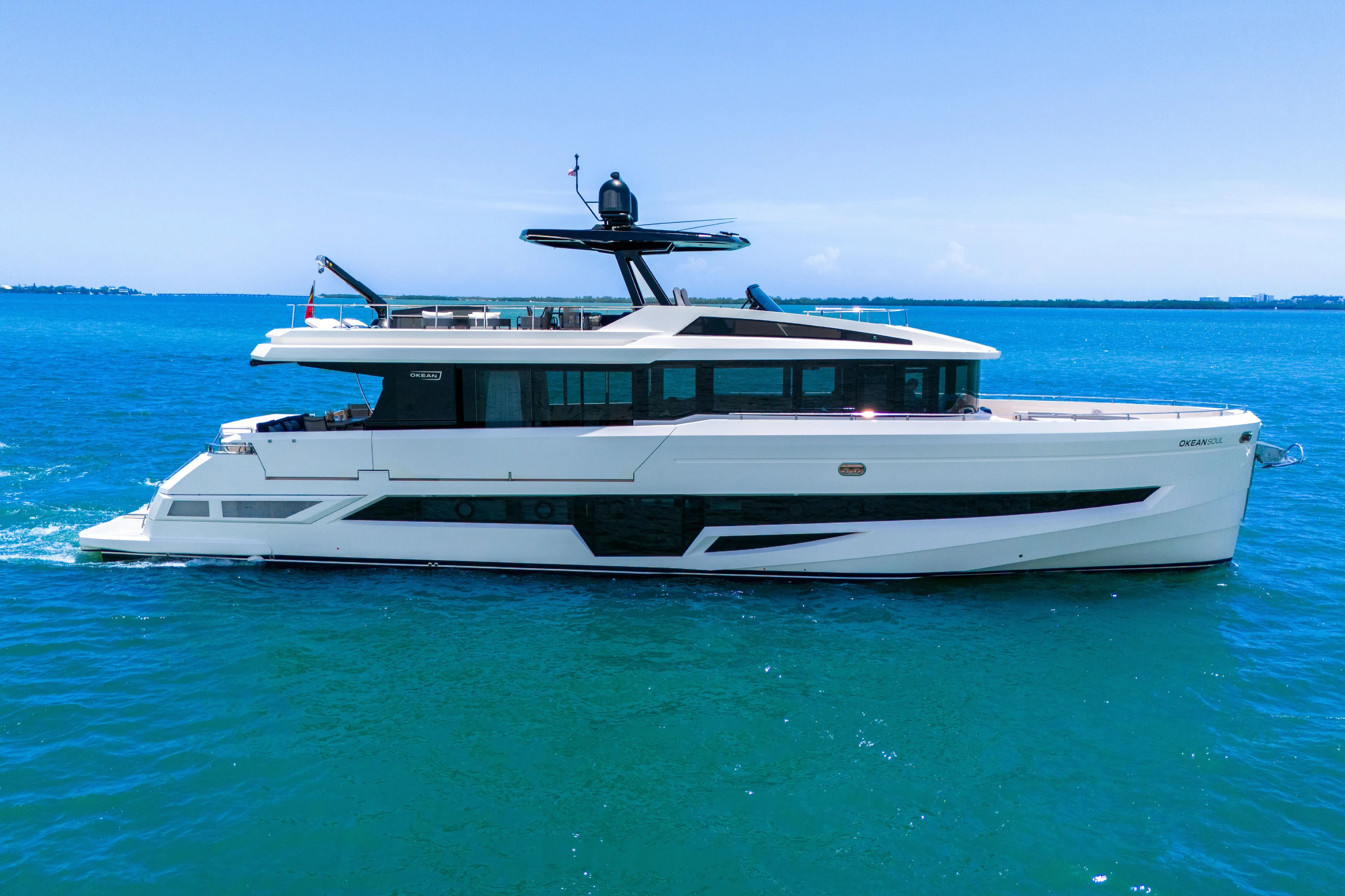  Yacht Photos Pics Luxury 2021 OKEAN 80 yacht cruising on clear blue ocean waters.