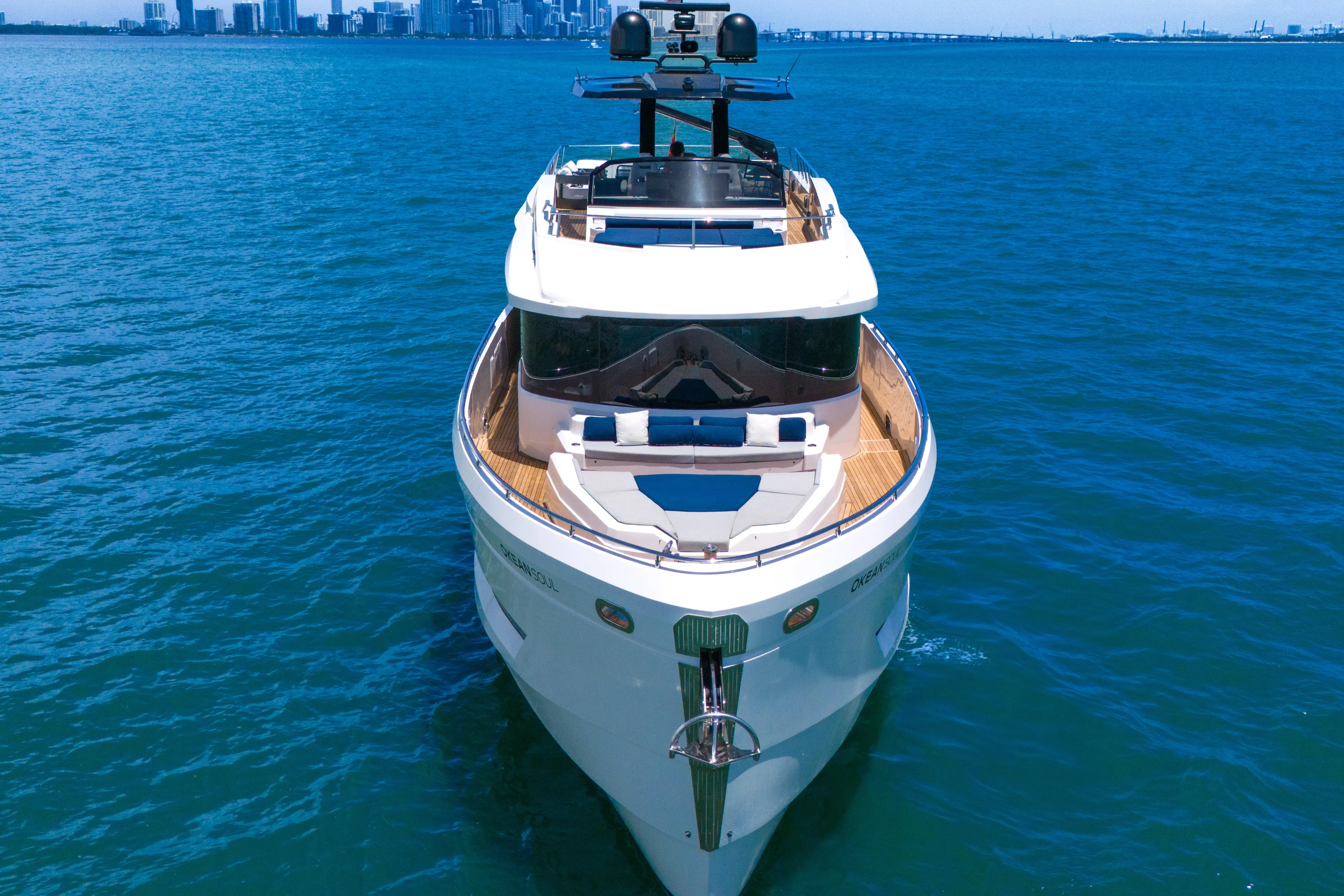  Yacht Photos Pics Luxury 2021 OKEAN 80 yacht cruising on blue ocean near city skyline.