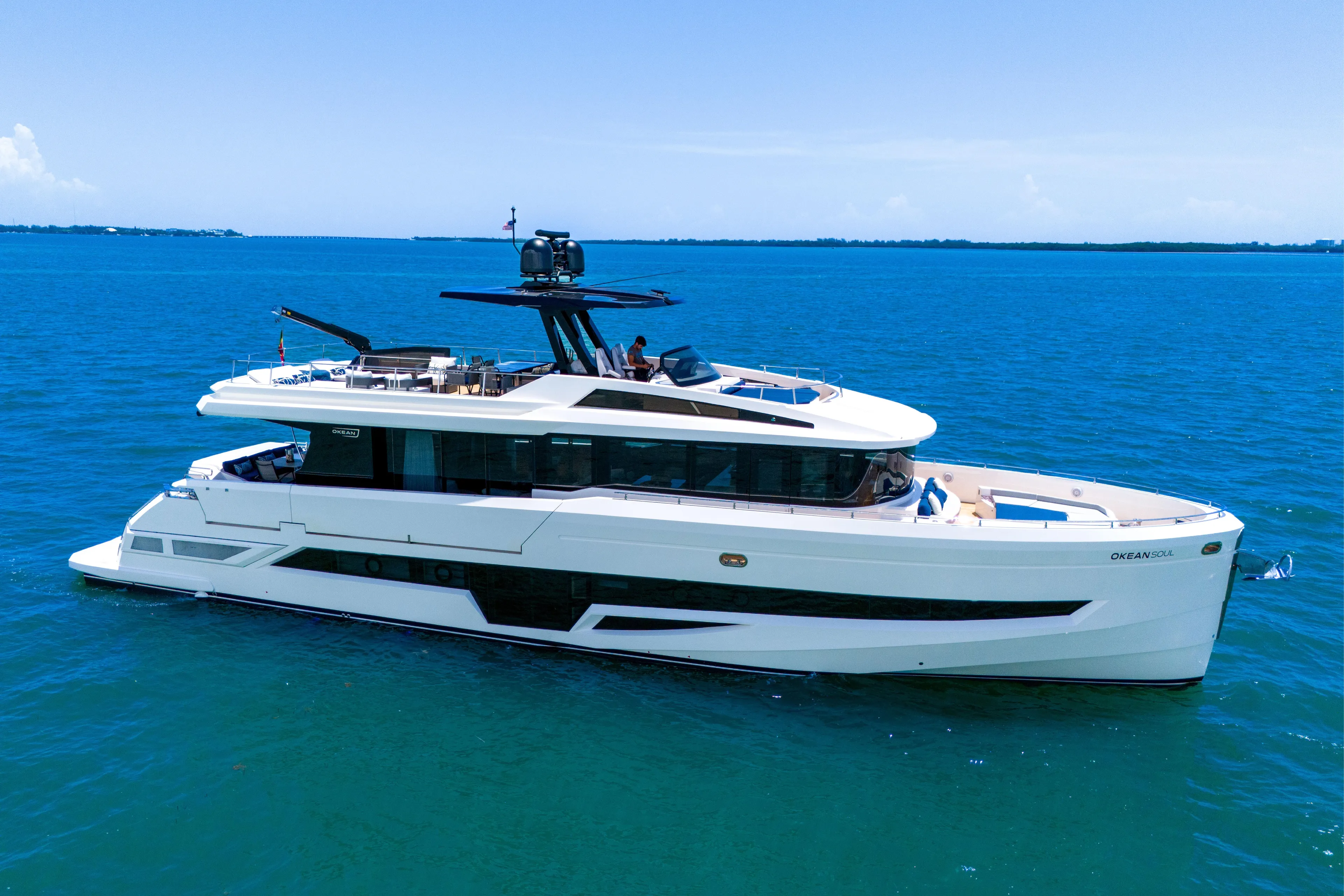  Yacht Photos Pics Luxury 2021 OKEAN 80 yacht cruising on clear blue ocean waters.