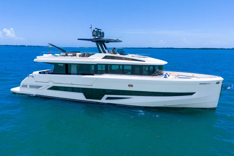  Yacht Photos Pics Luxury 2021 OKEAN 80 yacht cruising on clear blue ocean waters.