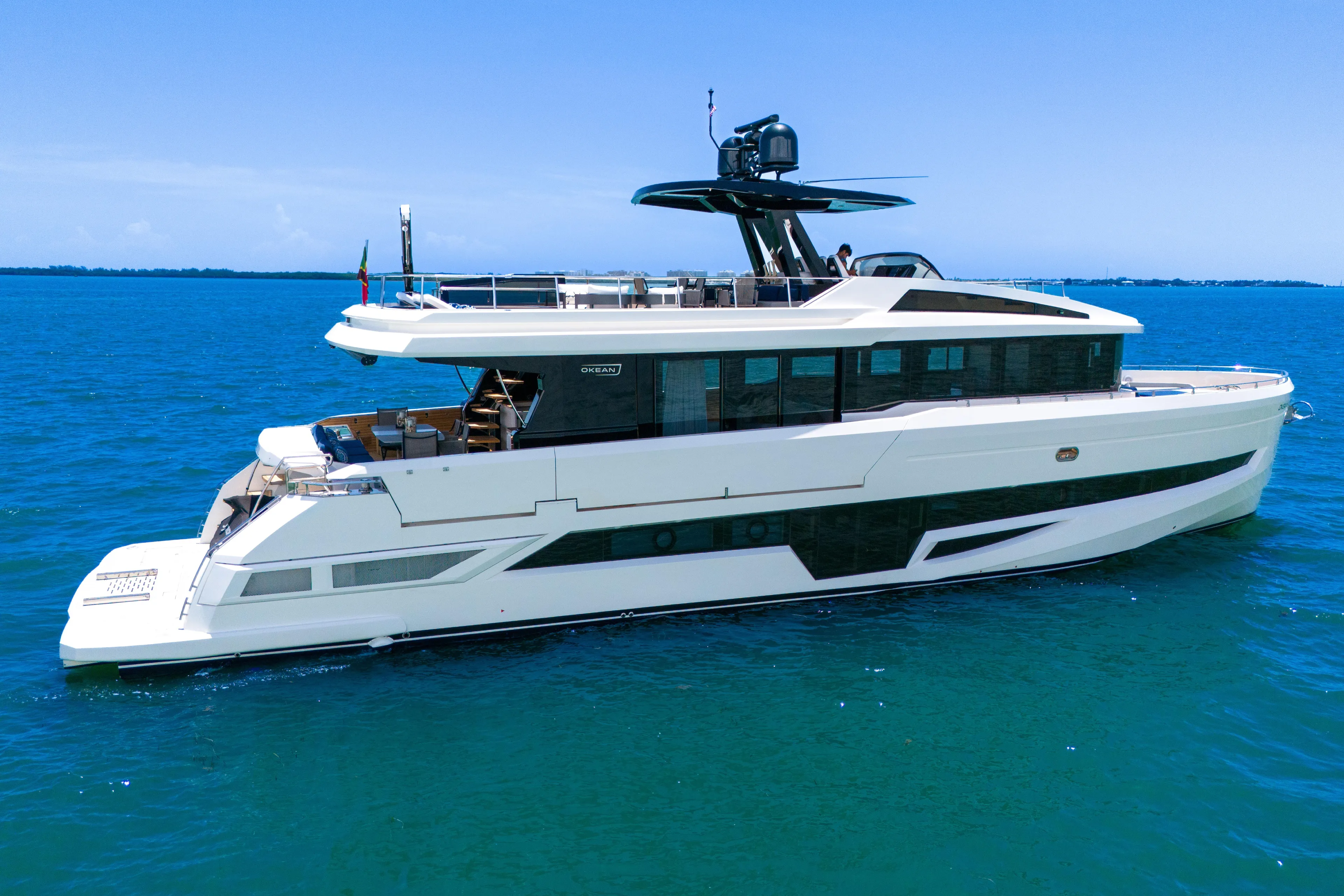  Yacht Photos Pics Luxury 2021 OKEAN 80 yacht cruising on clear blue ocean waters.